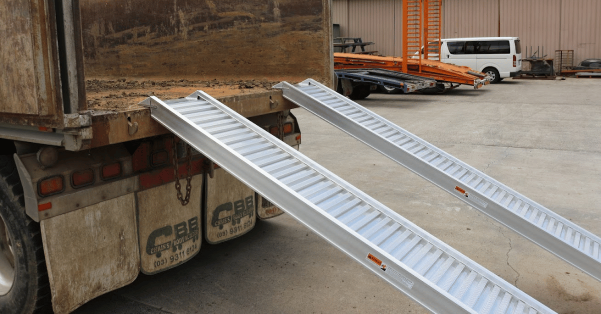 pair of aluminum ramps installed on a ute
