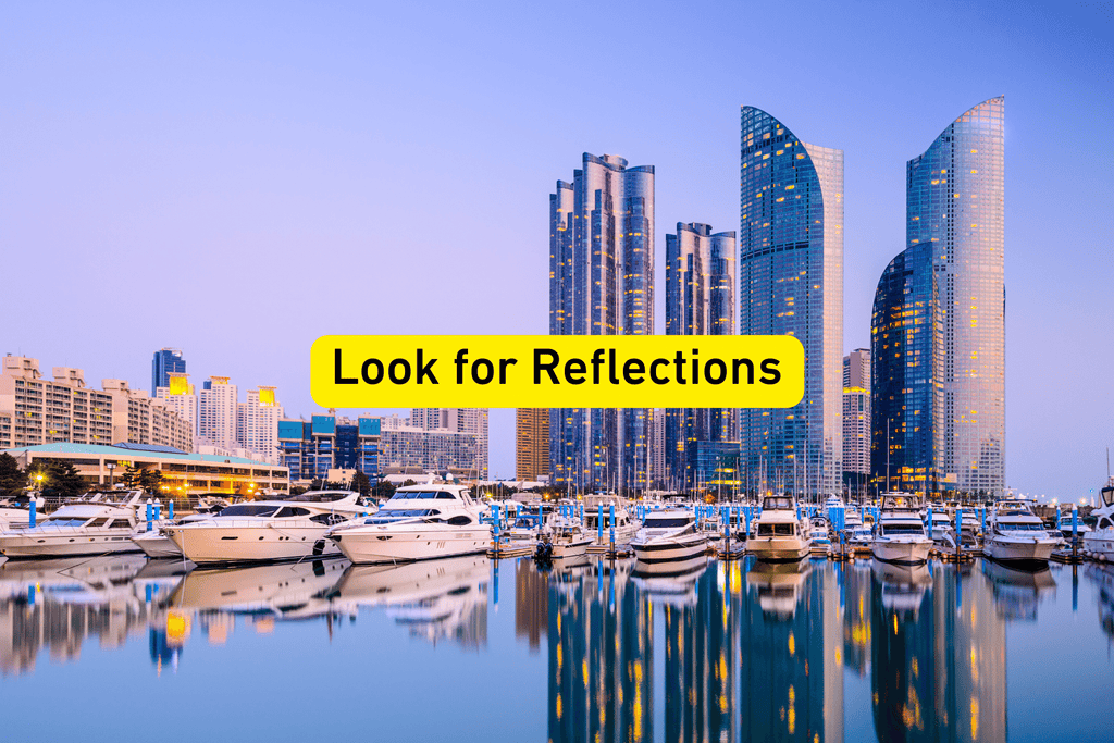 City skyline and its reflection in a body of water