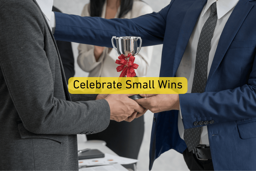 close up photo of a person receiving an award with Celebrate Small Wins text overlay