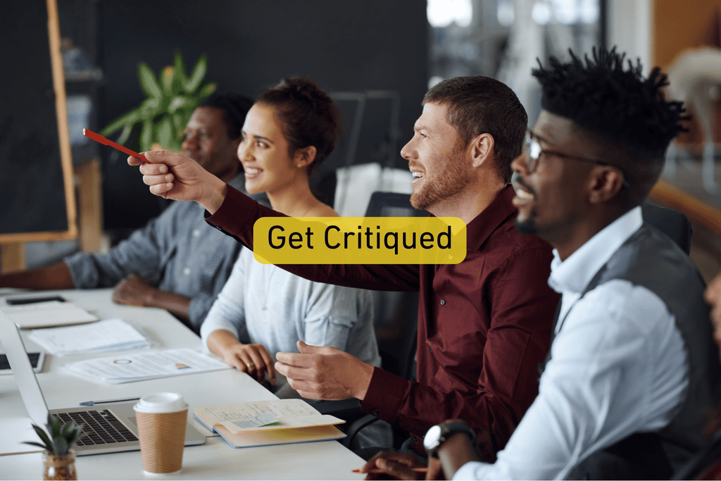 a group of people sitting and pointing at a computer screen with Get Critiqued text overlay