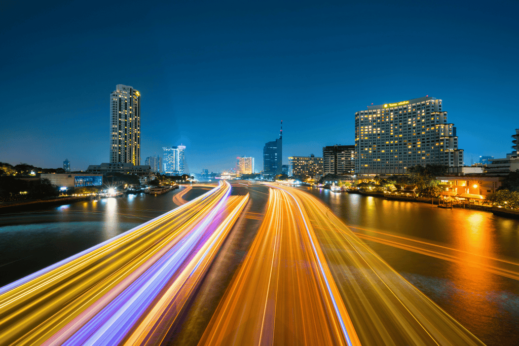 long exposure photo of a highway and a city in the background