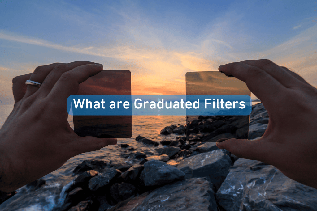 person holding two square graduated filters at the beach at sunset