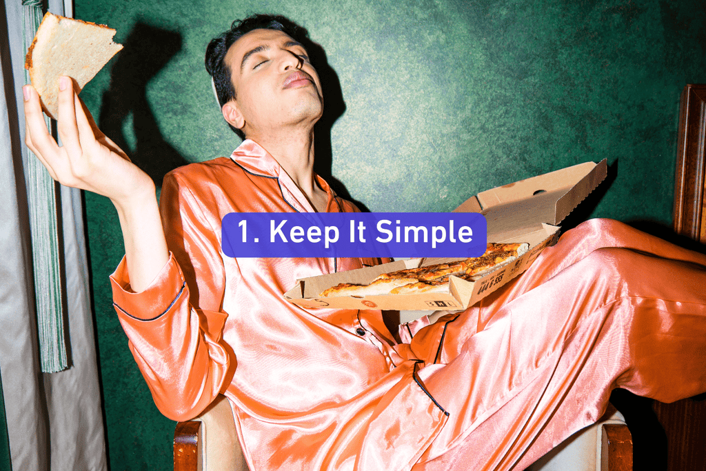 a young guy in pink pajamas eating pizza
