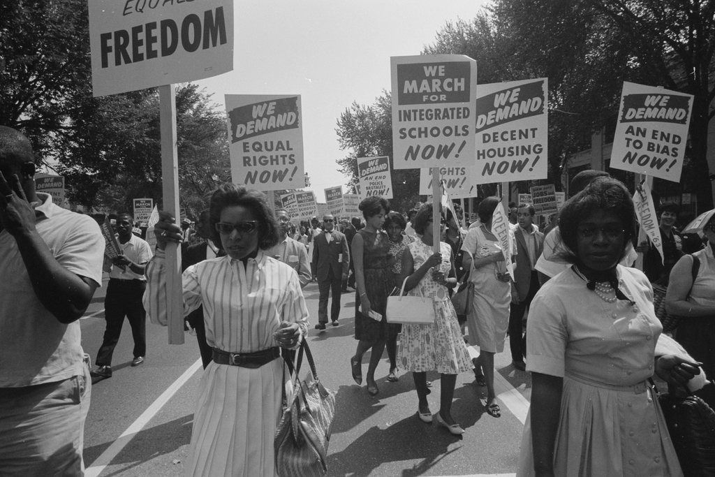 black and white photo of civil rights protestors marching with signs