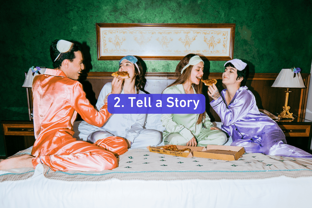 a group of young adults in silk pjs having a pizza slumber party in bed