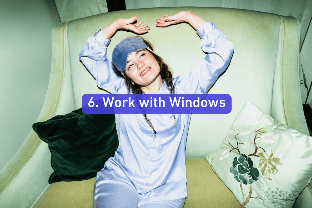 a young women stretching next to a window while sitting down