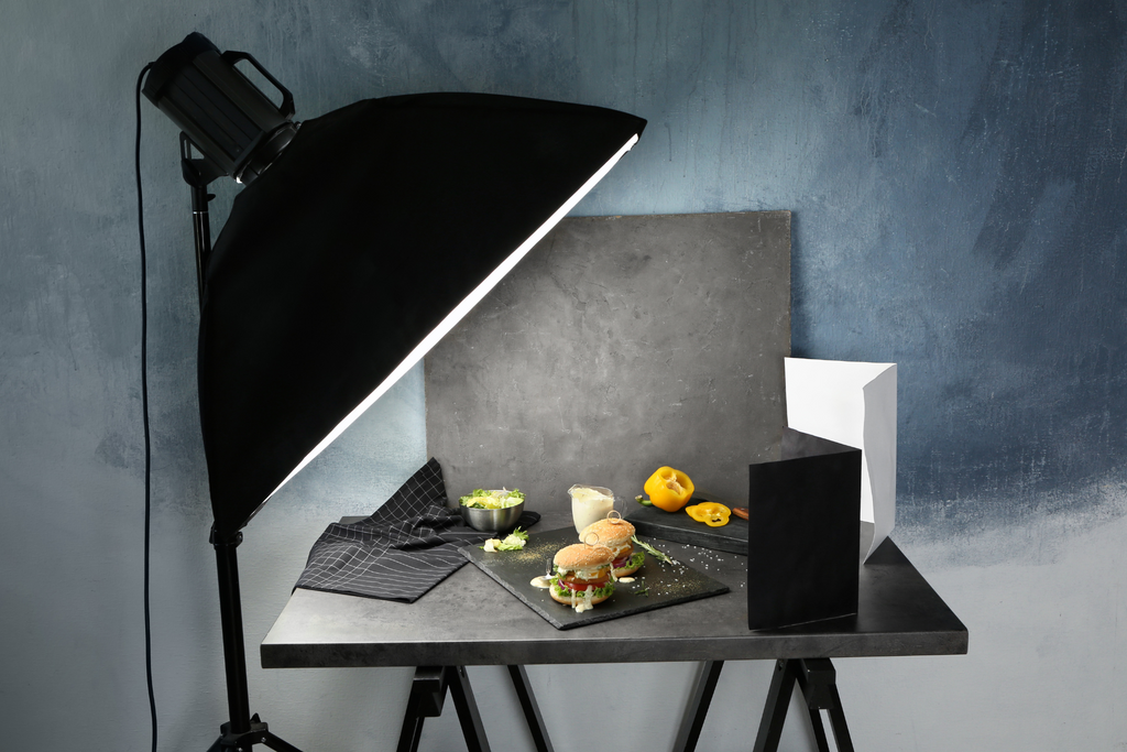 Table top photo studio of food with grey background and soft-box