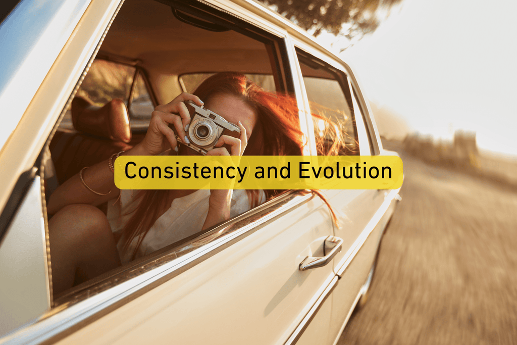 woman taking a photo through the window of a car with Consistency and Evolution text overlay
