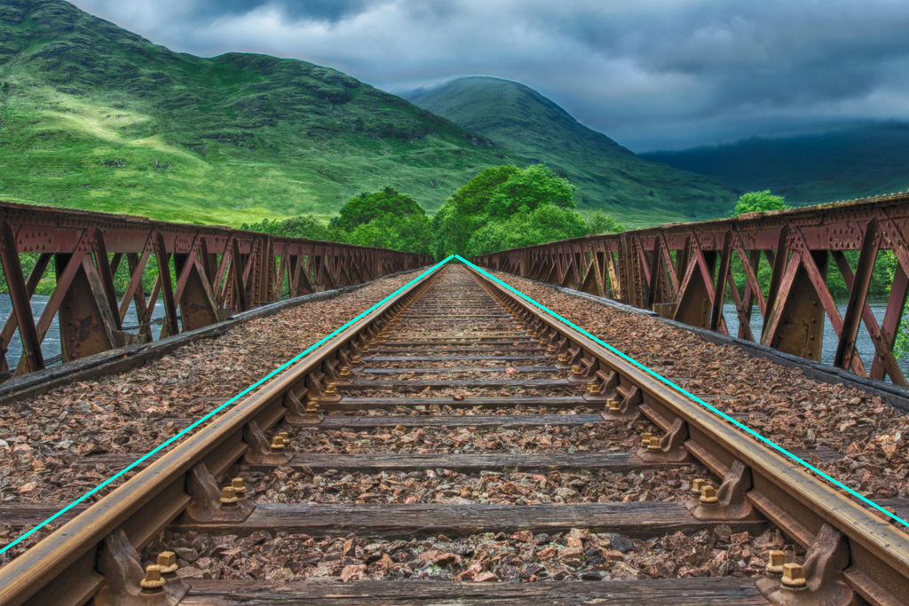 low angle photo of a rail road track on a bridge, converting leading lines overlay