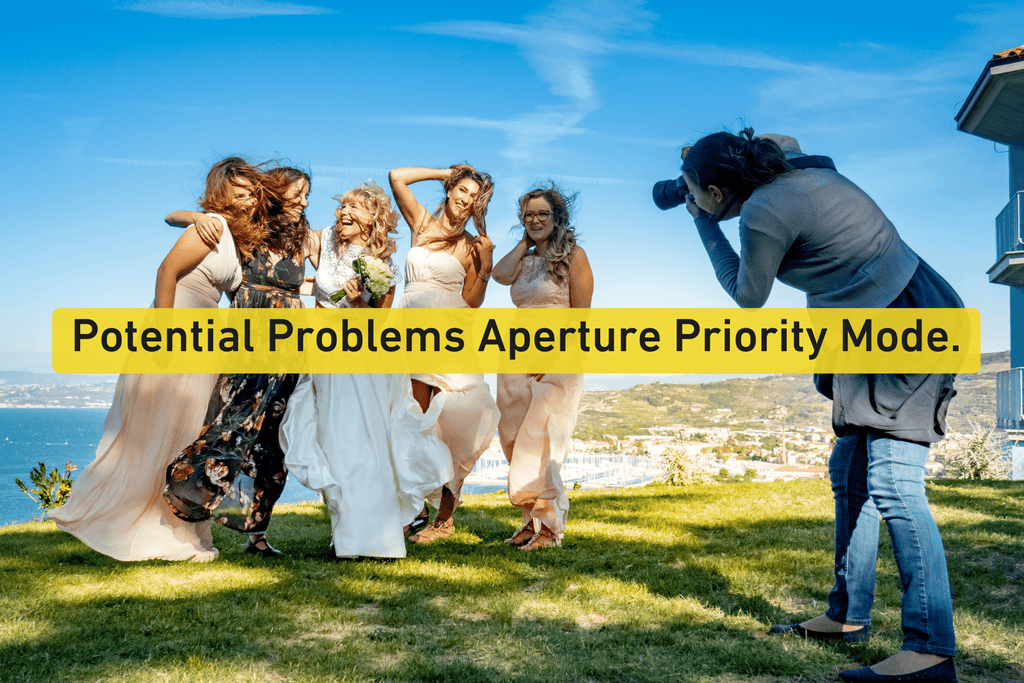 photographer taking a photo of a bride and bride's maids