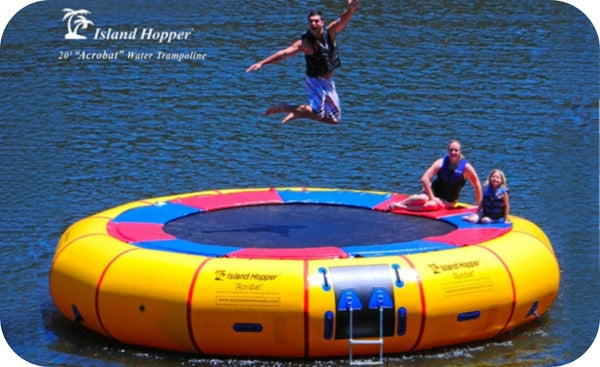 2 Island Hopper Classic 15ft Water Trampolines sit side by side on a lake. One is green, 1 is yellow.