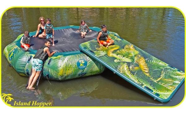 Island Hopper 15ft Lakeside Graphic Series Inflatable Water Bouncer Park.  5 kids relax and slide down the slide while an adult sits on the side.