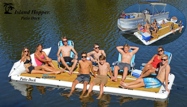 Family and friends sit on an Island Hopper Patio Dock Inflatable Dock. They have a cooler and a folding chair. Others sit directly on the inflatable dock. There are 9 people on the inflatable dock.