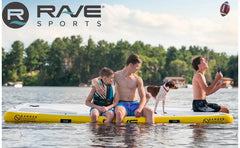 Rave Aqua Dock 10 Inflatable Dock. Three young boys sit on a Rave Aqua Dock 10 Inflatable Dock on the lake.