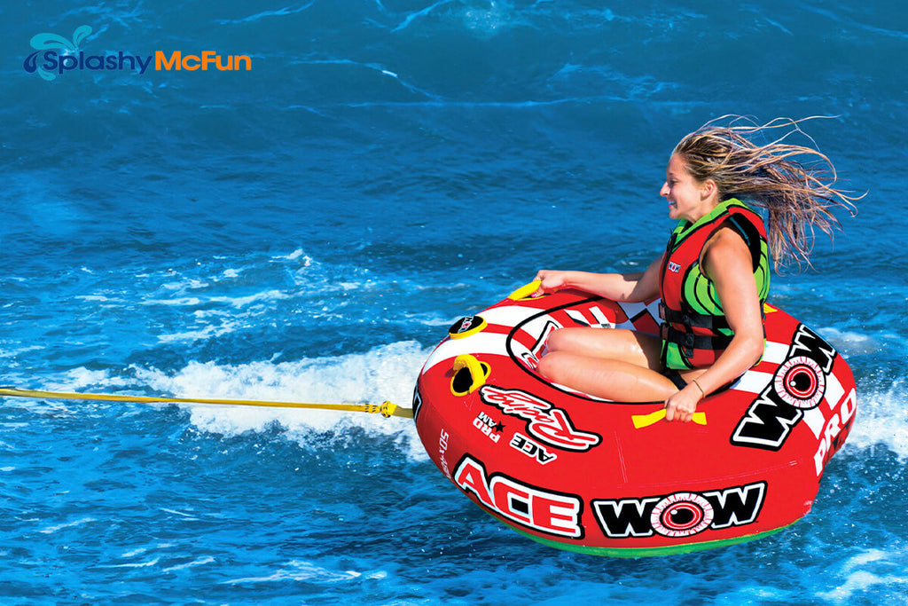 This is an Open Top Tube in action with 1 person sitting on the center while being dragged by a boat on the water.