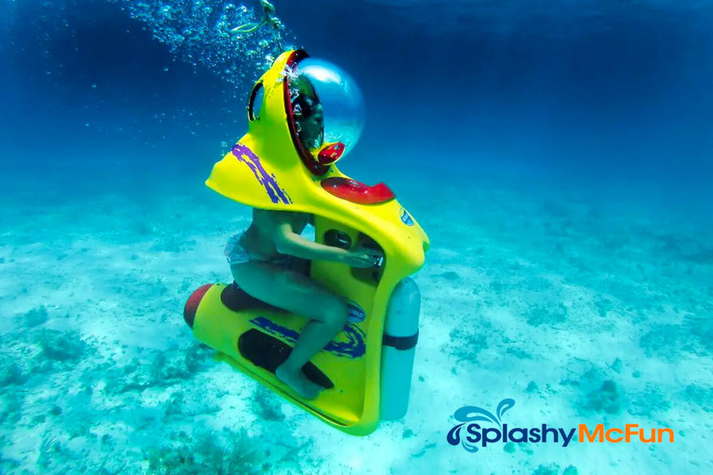 Girl rides an underwater dive scooter