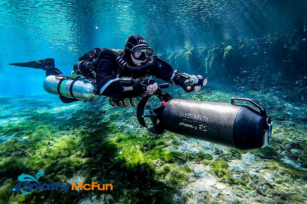 A diver uses a large underwater scooter to explore marine life and reefs.