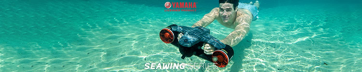 Yamaha SeaWing 2 Sea Scooter is used by a young man near a sandy bottom of an ocean.
