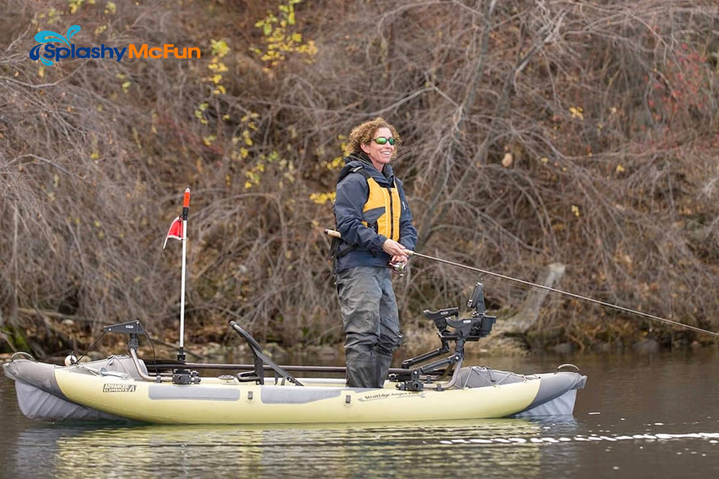 The Advanced Elements StraitEdge Angler Pro Kayak on the water with a fisherman onboard standing actively fishing.
