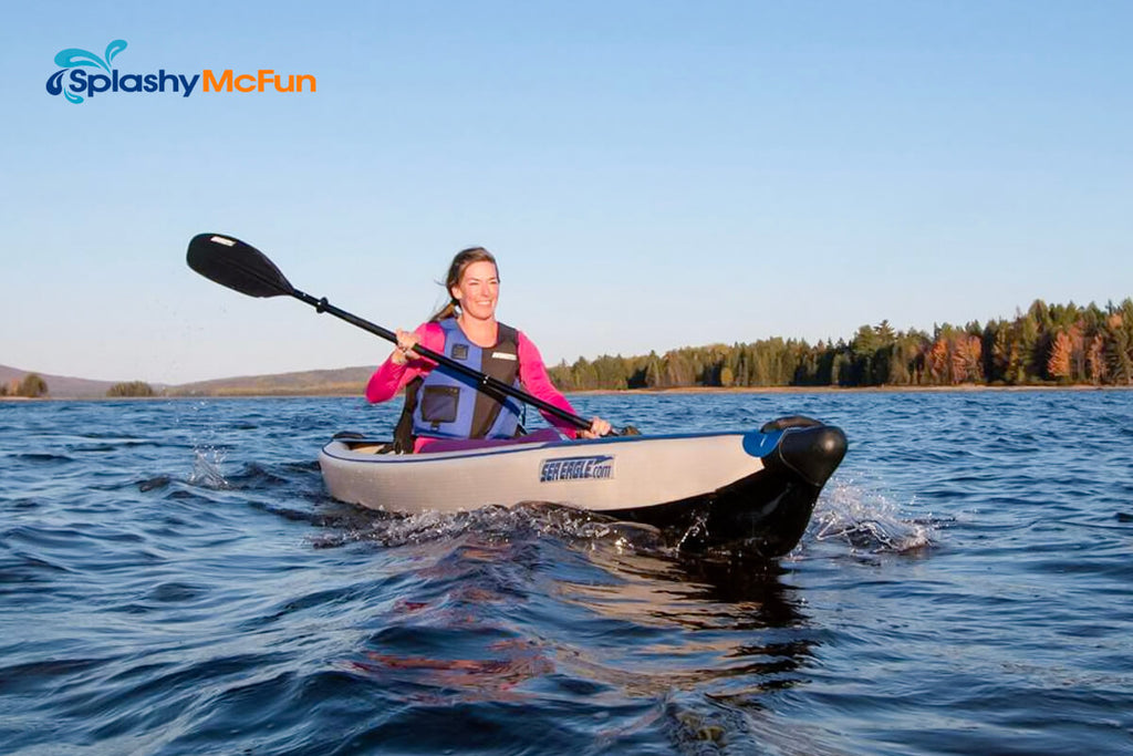 The Sea Eagle RazorLite 473rl Tandem Inflatable Kayak in action with a female onboard out on the water paddling.