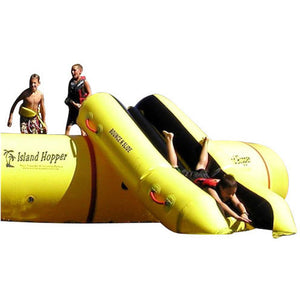 Island Hopper Bounce N Slide Attachment front view of one kid sliding down and two on the water trampoline next up to slide down the water slide. 