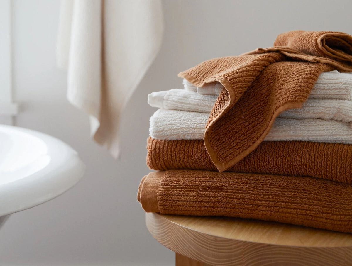 https://cdn.shopify.com/s/files/1/1268/4551/products/fig-linens-coyuchi-temescal-terra-bath-towels-closeup_1600x.jpg?v=1647886173