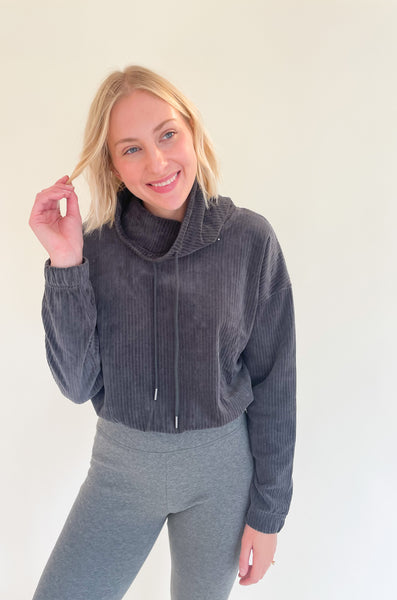 The UGG Calland Funnel Neck Top is an elevated pullover, perfect for the days that you want to look good, but also feel good. The fabric is very soft and comfortable. It is truly "busy day" approved. The corduroy texture is right on trend too! Of course you can dress this style up with jeans, but we created a casual look by pairing it with our UGG Leggings.