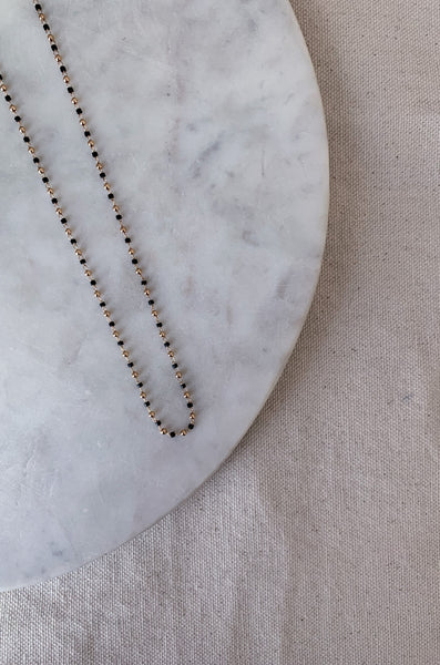 The Dainty Gold & Black Beaded Necklace is such a fun and unique necklace! This style is simple and classic, but has a pop of color. It can be worn everyday or for special occasions. What will you be wearing it with?  