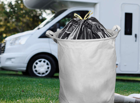 Pop-up laundry bags, lined with garbage bags are great for camping, are washable, and fold down to save space