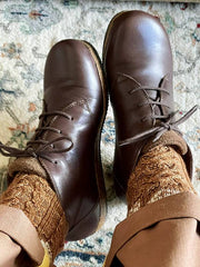 Comfy brown Stegmann chukka boots being shown off.