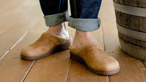 The Halstatt Leather Clog being shown off on a wooden background.