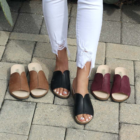 Comfortable and cute wedge arch support sandals for summer - The Layna Slide shown on a woman's feet with two other colorways on the left and right.