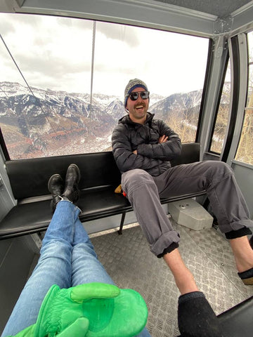 Benjamin of @sudsession on a ski trip in a ski lift wearing Stegmann wool clogs.