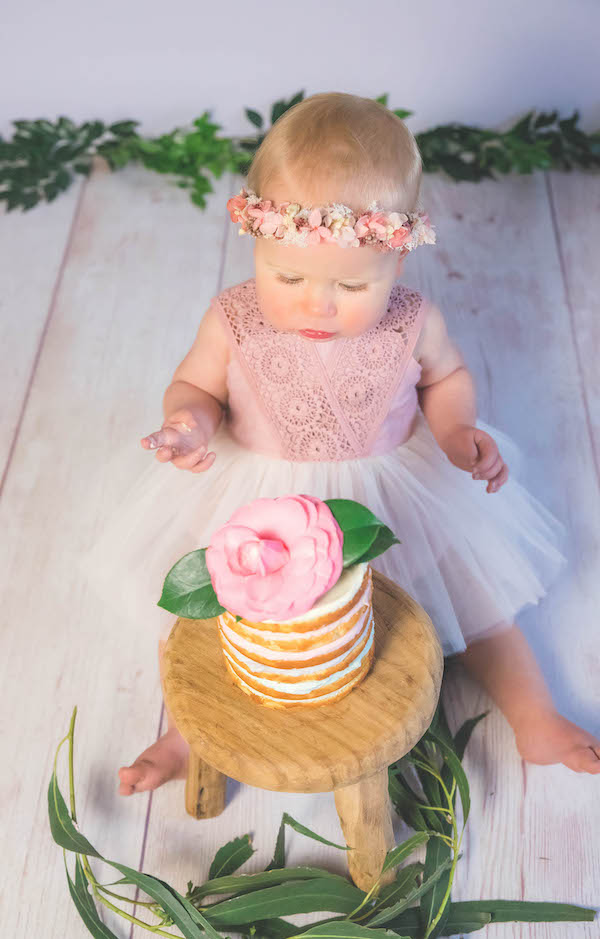 Baby wearing Tadah Patterns for DIY cake smash photoshoot