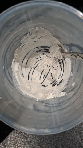 Mixing clay face mask ingredients