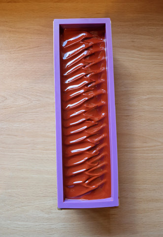 Pouring rooibos soap into moulds