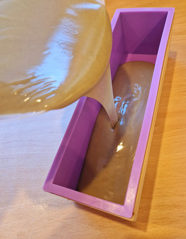 Pouring seaweed soap into moulds