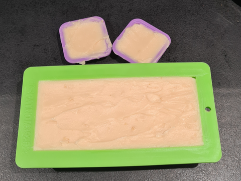 Pouring honey soap into moulds