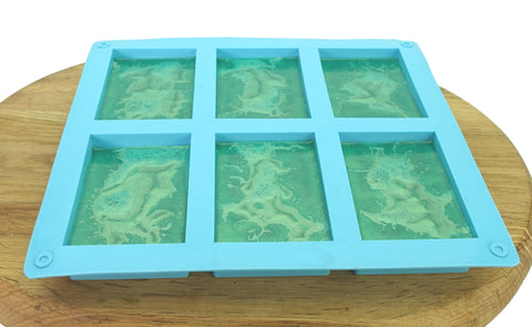 Pouring tea tree soap into moulds