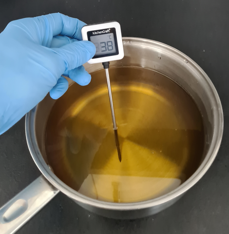 Checking temperature of oils for cold process soap making