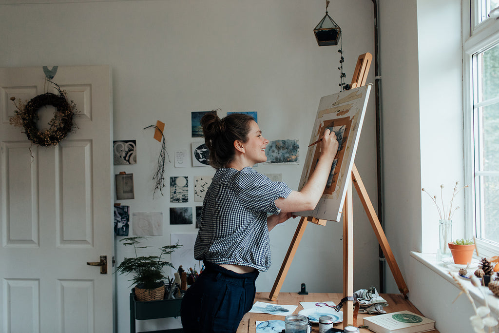 Agnes painting in her studio
