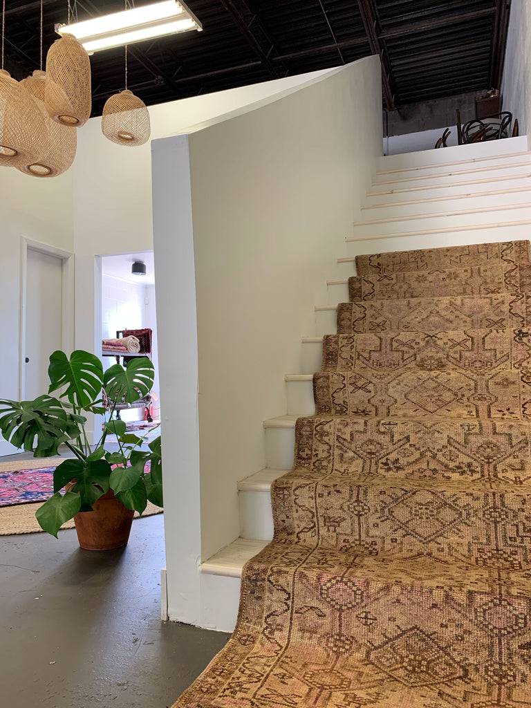 View of the new staircase - white staircase with a vintage runner