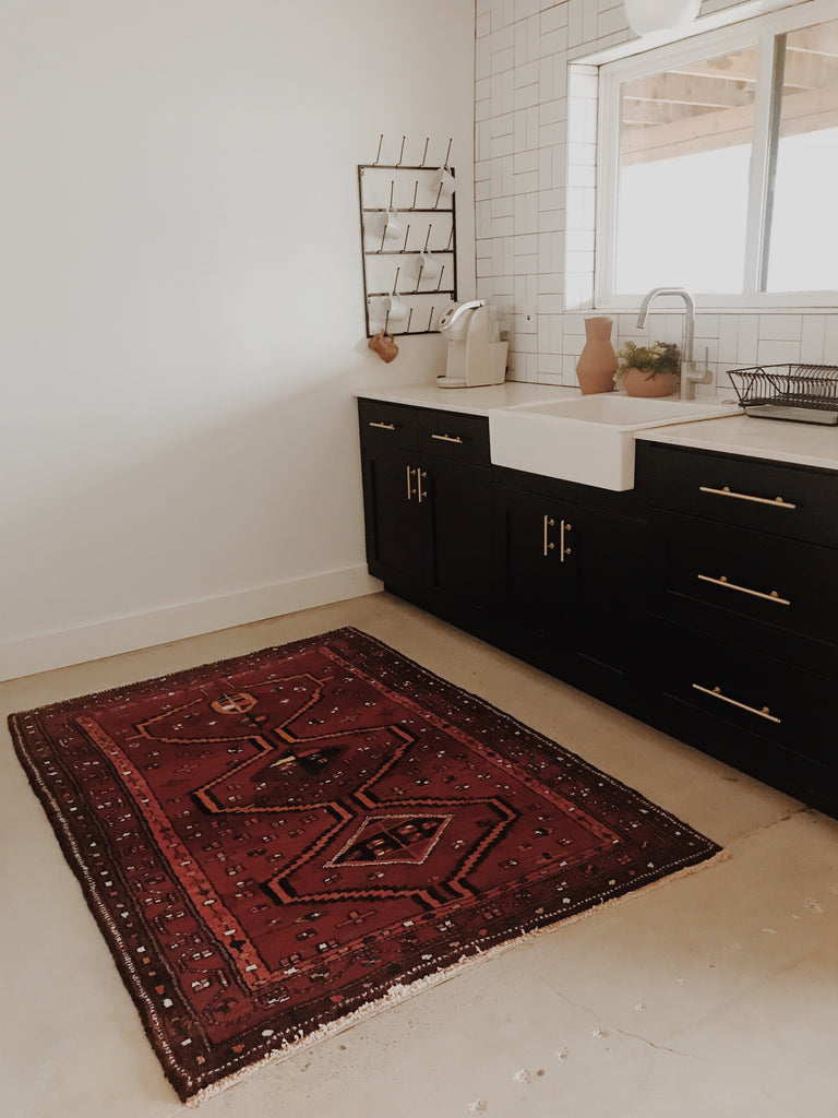 Cristina Stauber laundry room with a vintage Swoon Rug