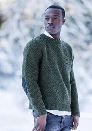 A man in a knitted pullover