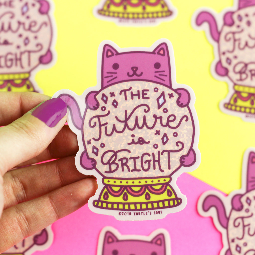 https://cdn.shopify.com/s/files/1/1271/9431/products/Future-Is-Bright-Fortune-Teller-Kitty-Holographic-Vinyl-Sticker_1024x1024.jpg?v=1618537691