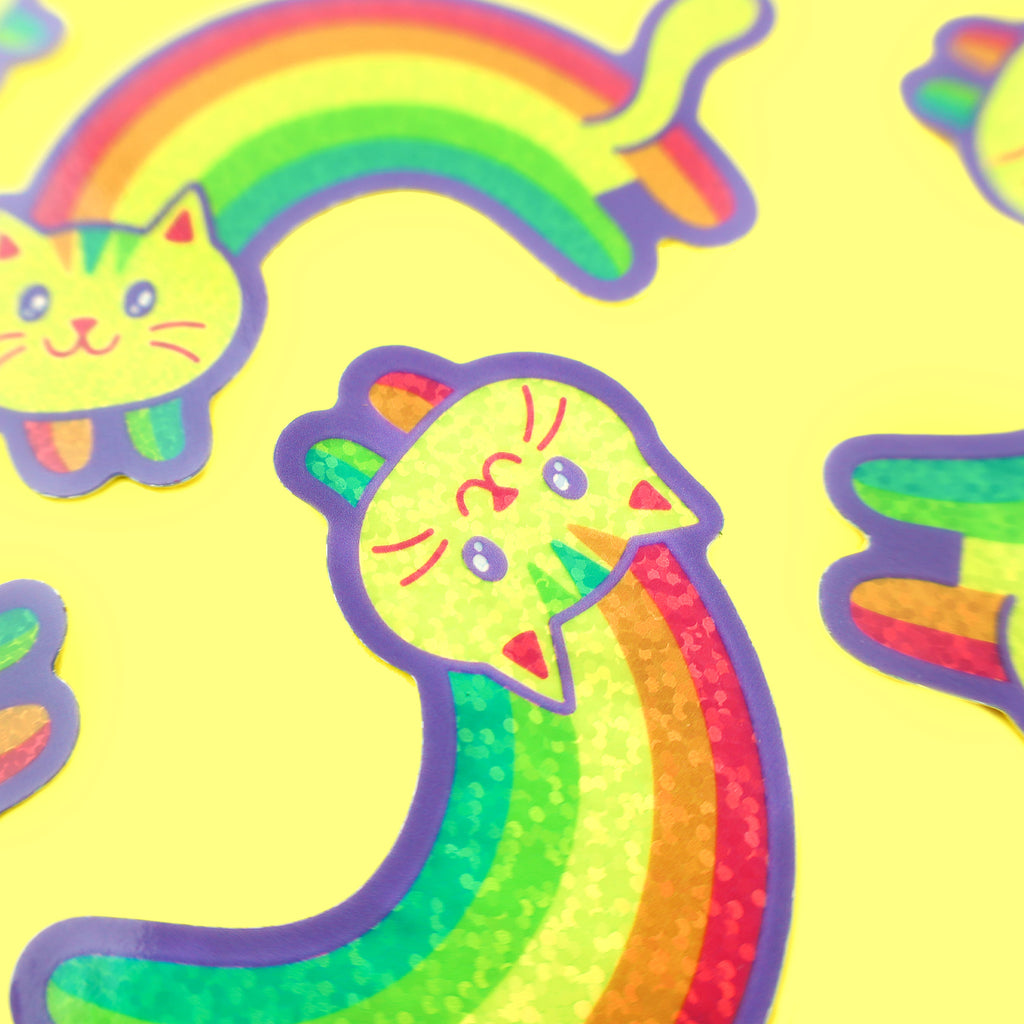 https://cdn.shopify.com/s/files/1/1271/9431/products/RainbowGlitterKitty-Vinyl-Sticker-For-Water-Bottle-by-Turtles-Soup-Cute-Cat-Lady-LGBT-Pride_1024x1024.jpg?v=1622741681