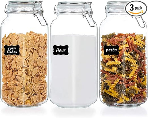 Three air tight glass jars arranged in a product photo. One holds snack crackers, one holds sugar, and one holds dried pasta.