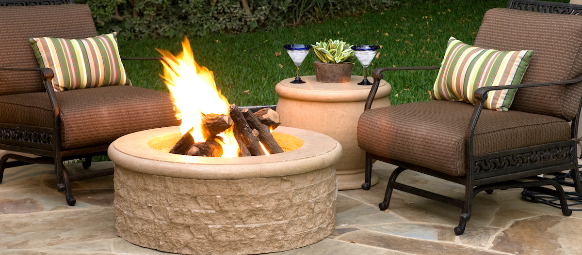 Propane Firepit with flames sitting between two rocking chairs