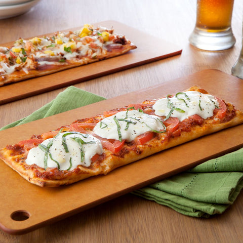 Flatbread pizzas on a cutting board