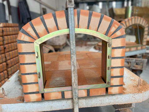 Lisboa brick pizza oven being built in Portugal warehouse